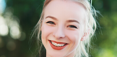 smiling young woman with braces